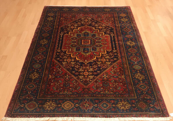 Persisk tæppe i varme farver